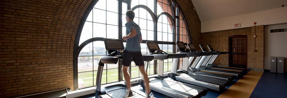 Student exercising on a treadmill